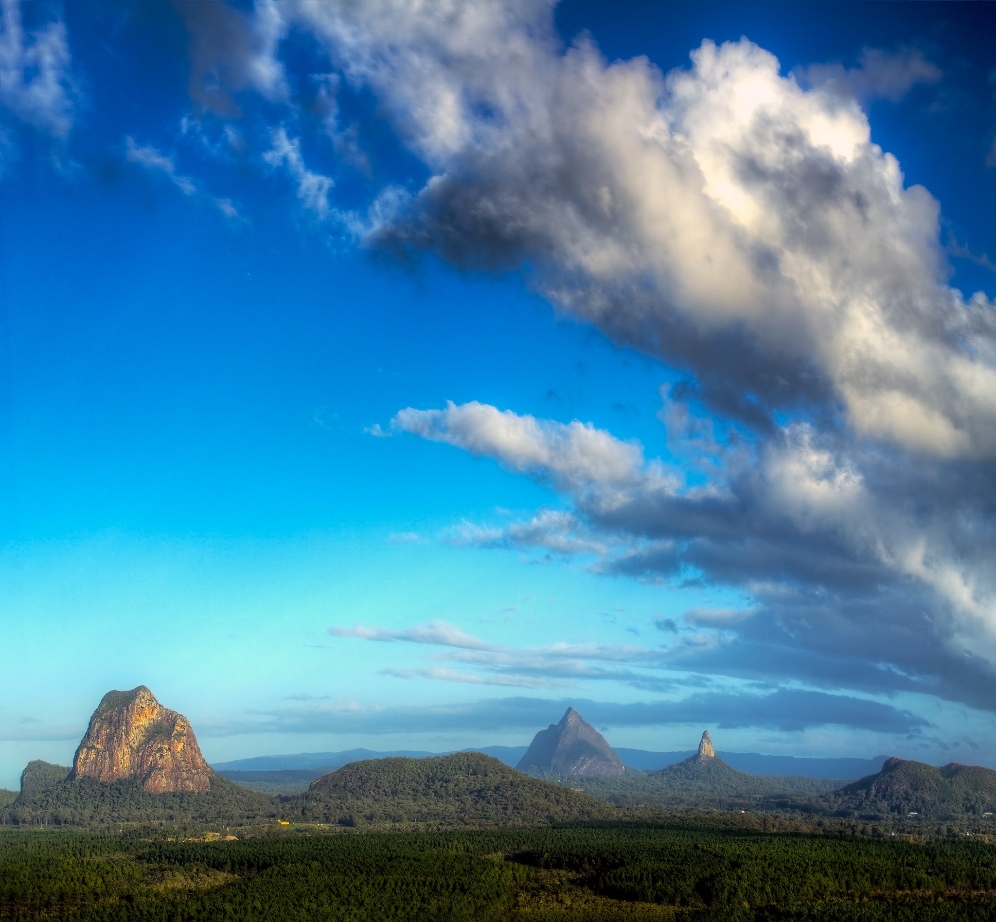 Rapidly encroaching clouds above the Glasshouse Mountains taken from atop Wild Horse Mountain in Queensland Australia
